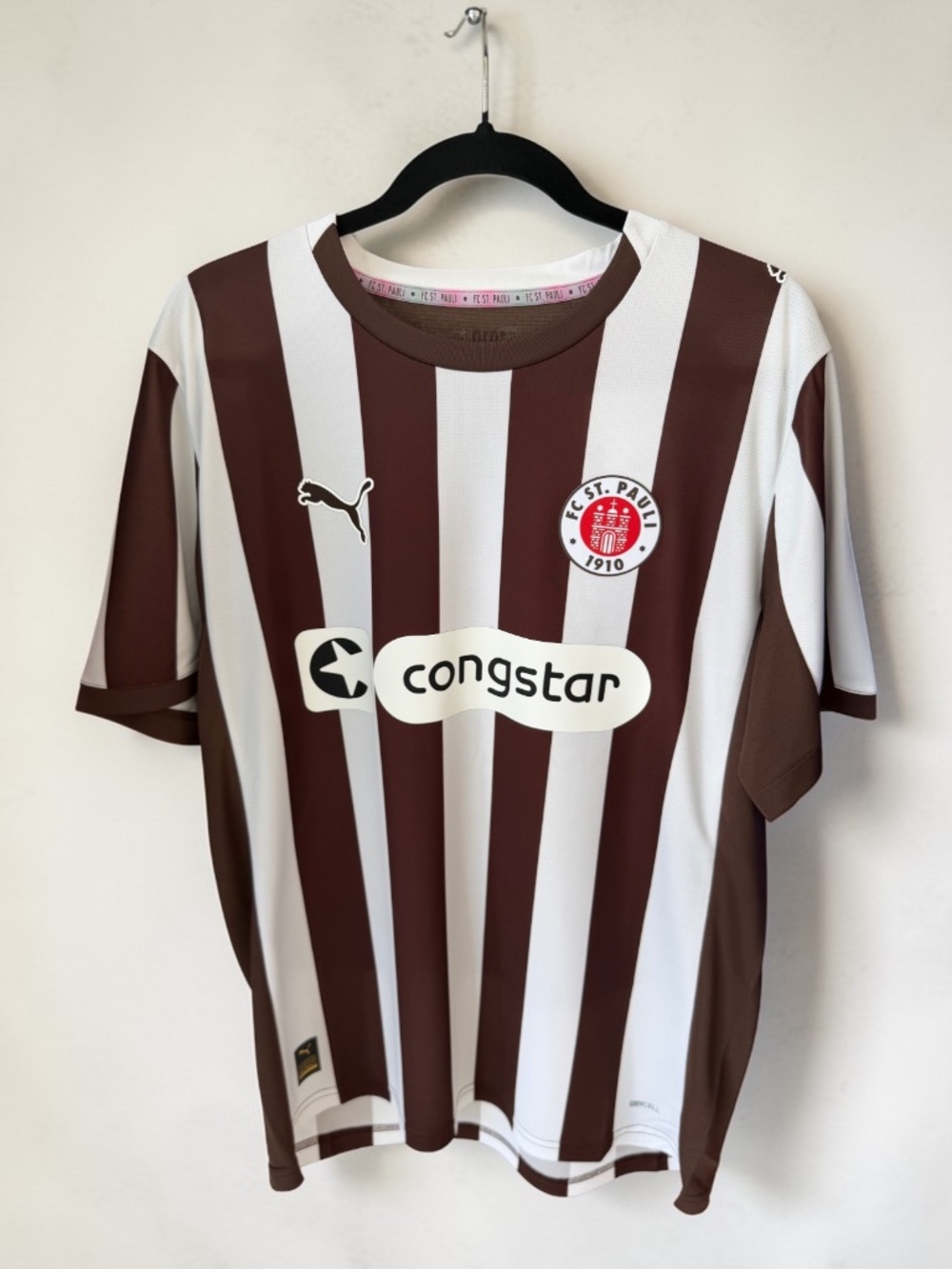 Show your support for FC St. Pauli with this official Puma 2025/26 Home Soccer.